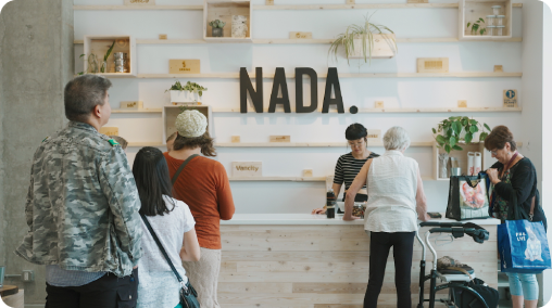 People lining up at a Nada grocery store.